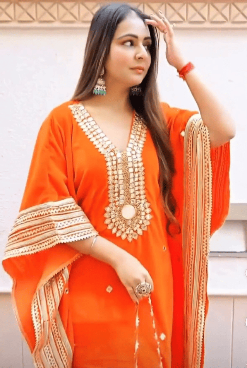 Regal Radiance: Orange Kaftan With Gold Zari Work And Mirrors