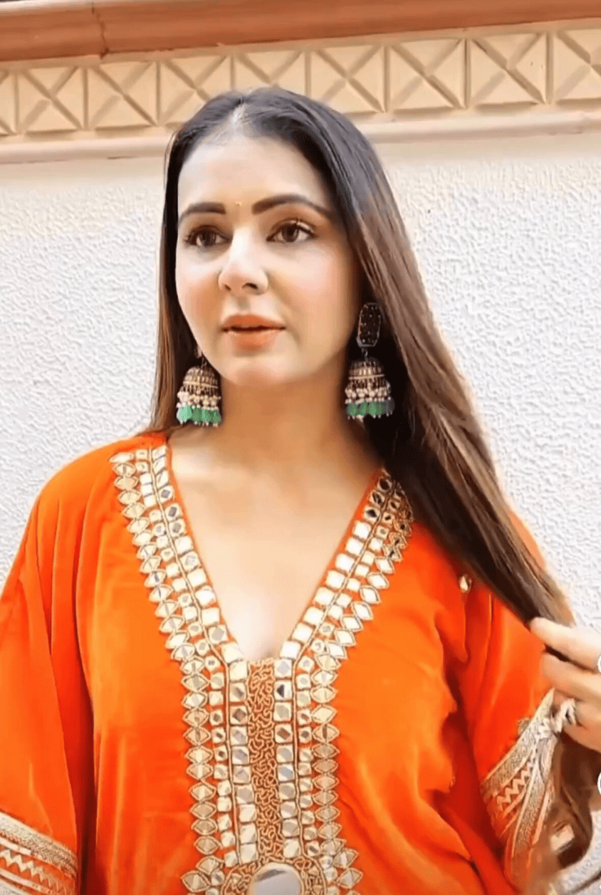 Regal Radiance: Orange Kaftan With Gold Zari Work And Mirrors