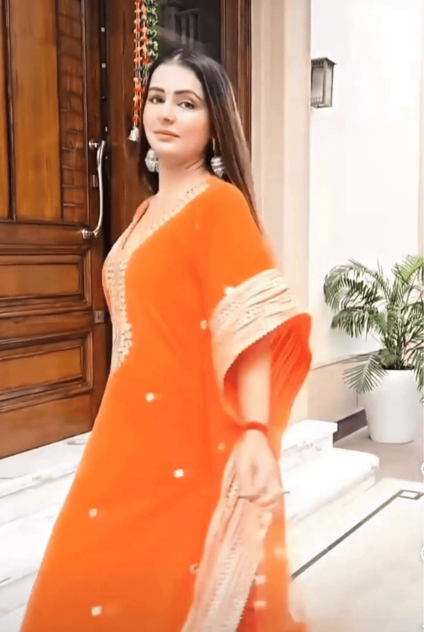 Regal Radiance: Orange Kaftan With Gold Zari Work And Mirrors