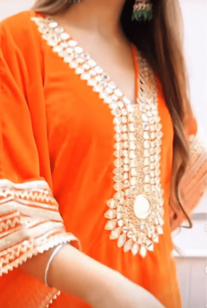 Regal Radiance: Orange Kaftan With Gold Zari Work And Mirrors